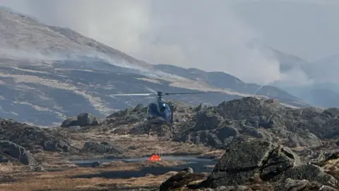 Evacuations as wildfire in Scotland spreads north through forest