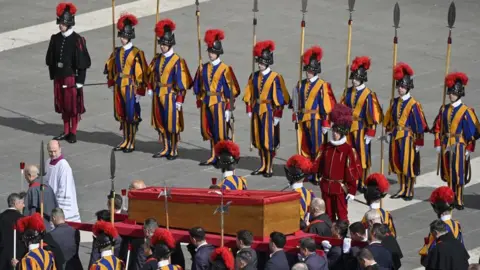 Thousands queue through the night to pay respects to Pope