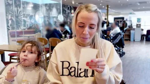 Rising prices push middle-income families to skip restaurants and days out